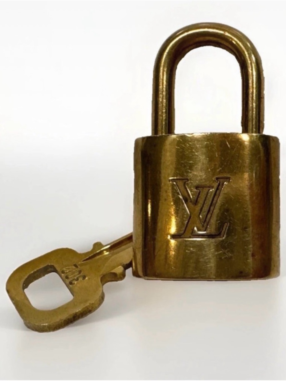 Louis Vuitton Gold Padlock and Key Set